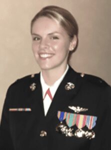 female marine wearing black uniform with ribbon bar and medals